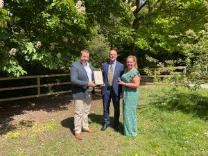 Lee and Jenni Percy receiving their silver kite award from Chairman of Powys County Council, Councillor Jonathon Wilkinson