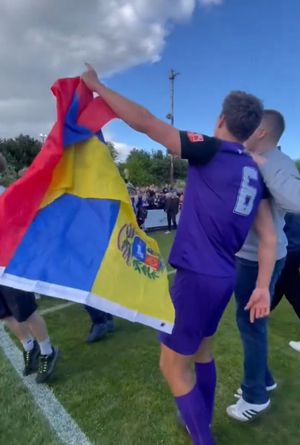 Oliver Cawthorne with a Venezuela flag brought to the game by a Telford supporter