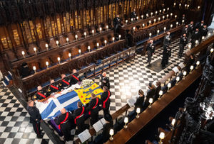 Royal Marine pall bearers carried the coffin into the chapel