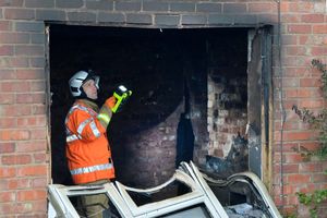 Fire investigators at the scene in Beacon Lane on Sunday
