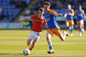 Tommy McDermott of Shrewsbury Town and former Salop loanee Tommi O'Reilly of Crewe Alexandra