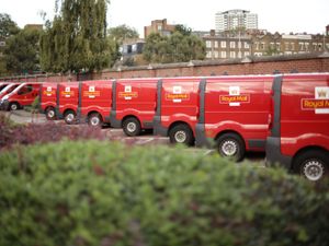 A row of Royal Mail delivery vans