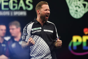 Danny Noppert celebrates beating Michael van Gerwen in the second round of the Mr Vegas Grand Slam of Darts (Picture: Kieran Cleeve/PDC)
