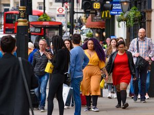 People walking on Parliament St in London, United Kingdom