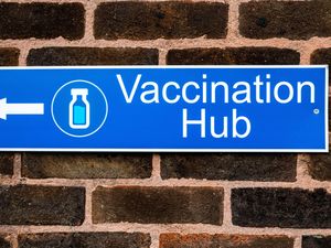 A sign for a vaccination hub