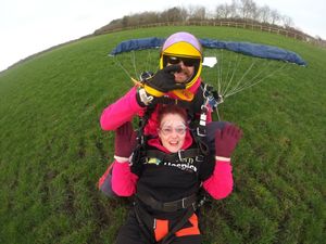 Supporting image for story: Thrill-seeking hospice volunteer 'still has her legs' after charity skydive