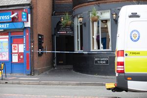 Police tape blocks off an entrance at the Golden Cross pub. Picture: John Kennett