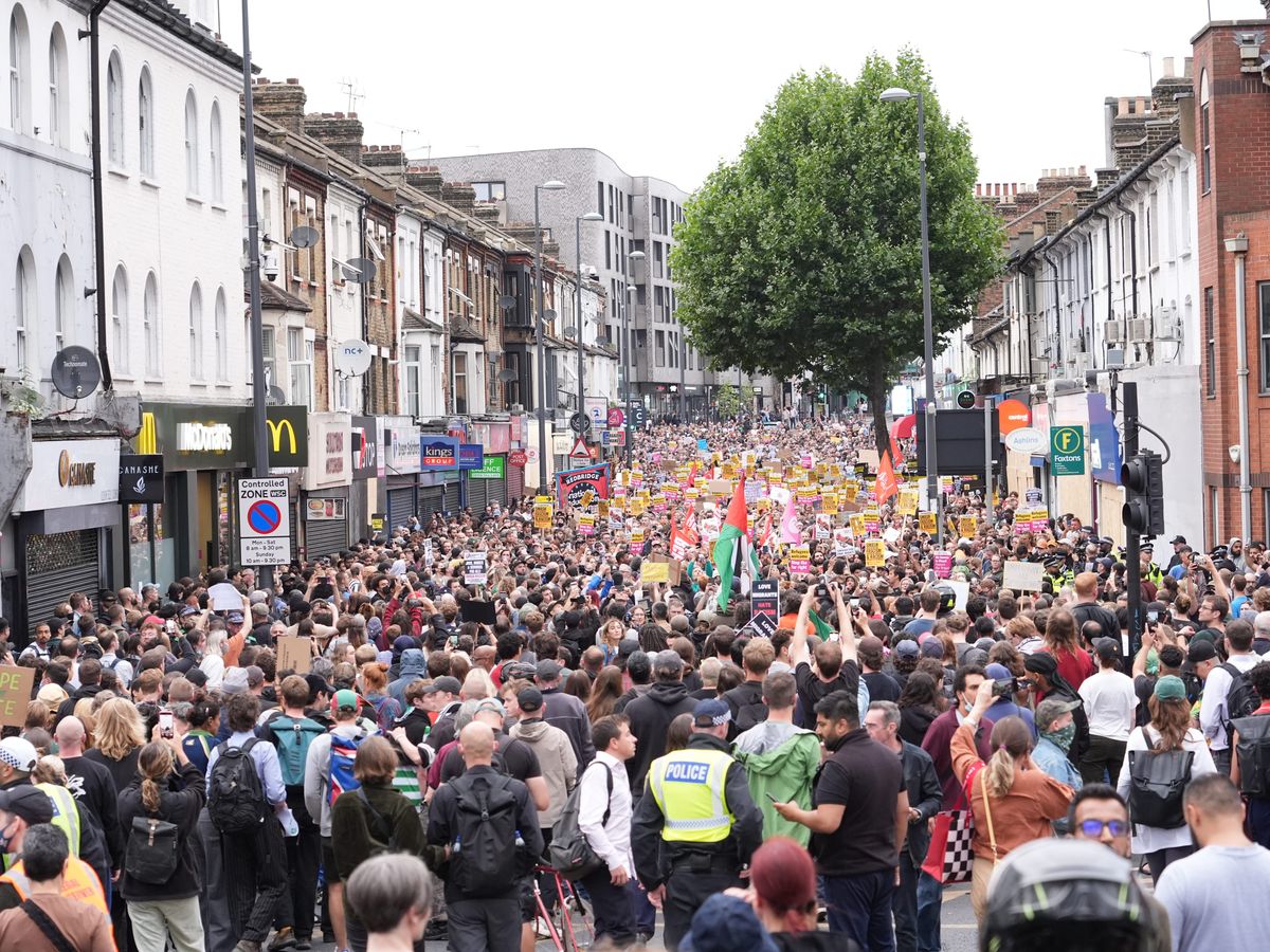 Suspended Labour councillor on trial over inciting violent disorder at protest Suspended Labour councillor on trial over inciting violent disorder at protest