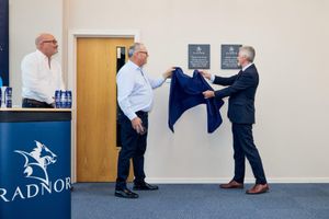Unveiling of the plaque. From left Simon Knight and William Watkins of Radnor Hills and Huw Irranca-Davies