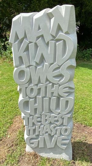 A stone carving by John Neilson to mark 100 years since Eglantyne Jebb drafted the historic Rights of the Child charter 
