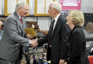 The duke presents awards to Jack and Denise Bond.
