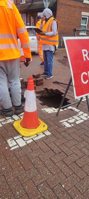 The hole has appeared in the ground at the junction of Vicarage Road and All Saints Way