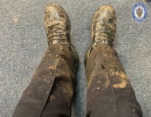 The drone operator's muddy legs 