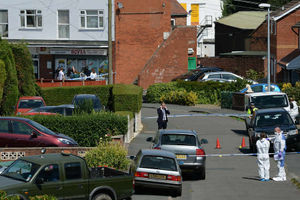 A police forensic team examines the scene at Meadow Close