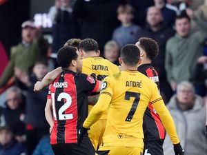 Wolves’ Matheus Cunha and Bournemouth’s Milos Kerkez confront each other