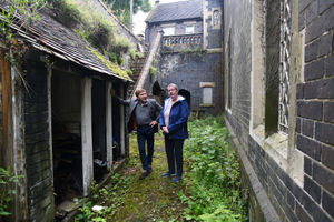 It's different for girls... Wayne Owen and Jean Wright at the girls' outside toilets. Boys had a long trek down steps almost as far as the Parish Rooms on Madeley Hill. Picture: Dave Bagnall.