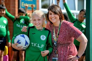 Tom Kirwan's niece Carly Johnson, 10, with headteacher Sophia Mulrooney