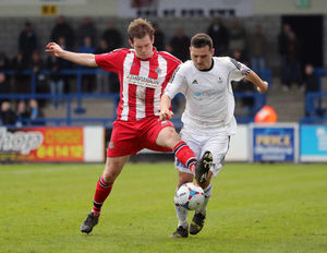 Shaun Densmore of Altrincham and Matty McGinn of AFC Telford United