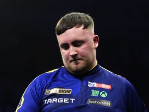 Luke Littler looks disappointed