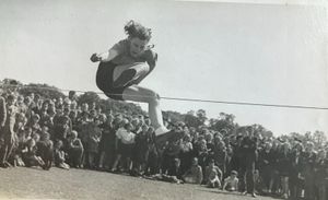 Gwen performing the high jump