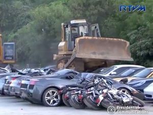 Supporting image for story: President of the Philippines oversees destruction of luxury machines worth £4 million