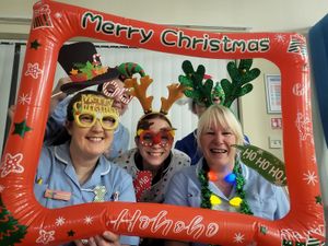 Georgia and her colleagues bringing the spirit of Christmas to patients on the hospice inpatient unit