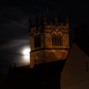 The moon peaking out behind St Mary's in Ellesmere. Photo: Sue Austin