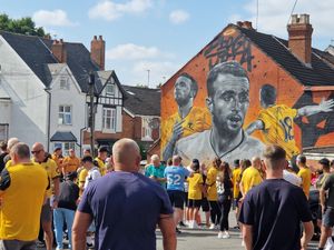 Wolves fans pay homage at the new memorial mural of Diogo Jota at the Leaping Wolf pub. 