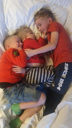 Brotherly love... Ezra with brothers Ethan and Eli.