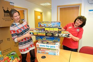 With a stack of games are Emily Jones from Hope House and Julie Hockenhall 