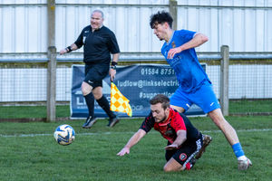 L.J. Bexon-Shaw battles for possession during Malmesbury Victoria’s commanding 4-0 win at Ludlow Town.
