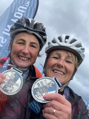 Lisa Lander, pictured right, with Steph Swain (left) after completing the ride across Britain for charity