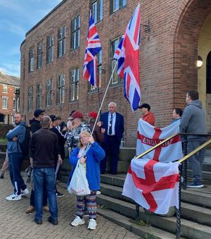 Dudley Council leader, Cllr Patrick Harley, talking with asylum protestors at Dudley Council House. Picture Martyn Smith/ LDRS free for LDRS use