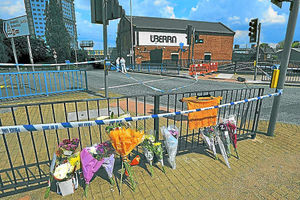 Flowers at the scene of the stabbing at the former Uberra club
