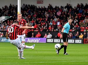 Evan Weir curls his free-kick into the top corner to open the scoring for Walsall