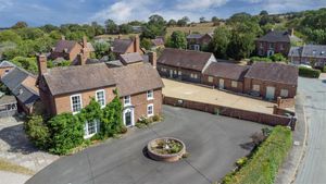 The property features a Grade II listed home and three barn conversions. Picture: Roger Parry & Partners/Rightmove