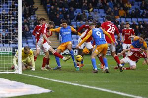 A goalmouth scramble during the game between Shrewsbury Town and Swindon Town
