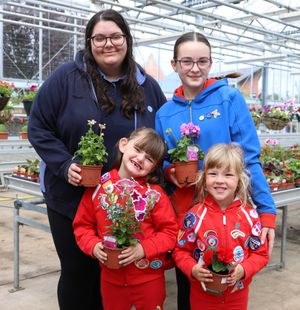 St Martins Guides. Young Leader Sarah Richardson (back left) with guide Daisy Jones (back right), and Rainbows Harriet Shuter and Ava Parry