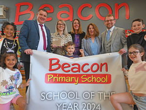 Supporting image for story: Walsall school with a working 'bank' where children earn coins and learn about the world wins award