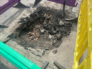 The pothole appeared last week and sits next to a BT manhole