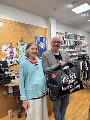 Resident Isobel Dale from HC-One’s Foley Grange Care Home with colleague at British Heart Foundation shop
