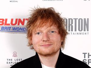 Headshot of Ed Sheeran smiling