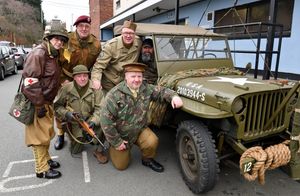 Re-enactors with their military vehicles outside the market