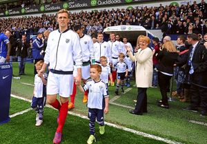 Widow Laraine Astle applauds the Albion players as they emerge from the tunnel onto the pitch at The Hawthorns in the 1968 kit on the day of the incident