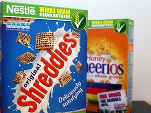 Boxes of Shreddies and Cheerios cereal