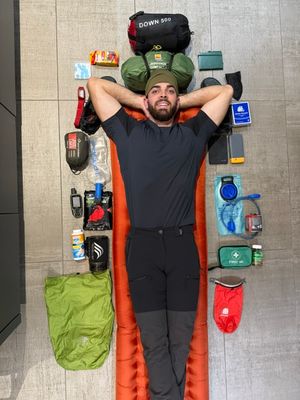 Alex is carrying around 20kg of supplies on his back whilst hiking.