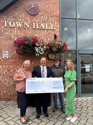 Market Drayton Town Council has provided funding for The Ginger and Spice Festival. Pictured (left to right) is Sarah Hopcroft, Councillor Tim Manton, Colin Mountford-Smith and Julia Roberts. Picture: MDTC