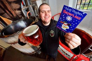 Sarah Hughes brewery manager Ricky Follos raises a glass to Snowflake's latest awards