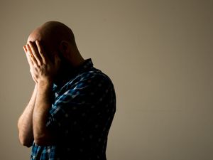 A man showing signs of stress