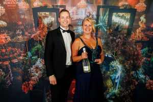 Chris Boehm of Leap IT in Hockley Heath presents an Excellence in Technology Award award to Alana Patchett of Purple Monster.